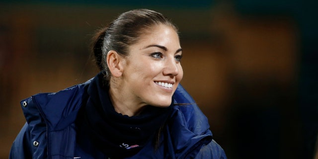 Oct. 20, 2014:  U.S. goalkeeper Hope Solo stands on the sidelines before a CONCACAF soccer match against Haiti in Washington.