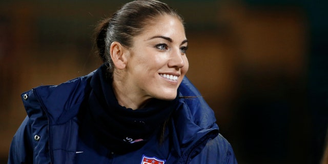 Oct. 20, 2014: U.S. goalkeeper Hope Solo stands on the sidelines before a CONCACAF soccer match against Haiti in Washington.