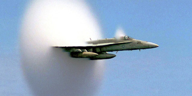 FILE: An F/A-18 Hornet breaks the sound barrier. The sonic booms have been known to shake buildings.
