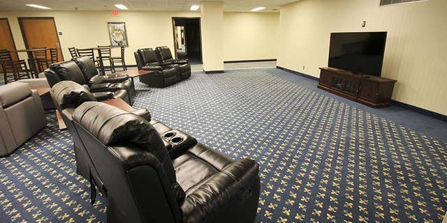 "Hotel Influenza" features private hotel-like rooms with television and internet, as well as common areas where volunteers can socialize.