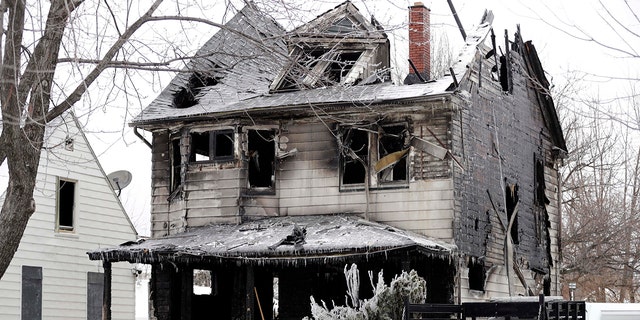 Four bodies were found at the site of a house fire, Tuesday, Jan. 30, 2018, in Cleveland.