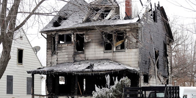 Four bodies were found at the site of a house fire, Tuesday, Jan. 30, 2018, in Cleveland.