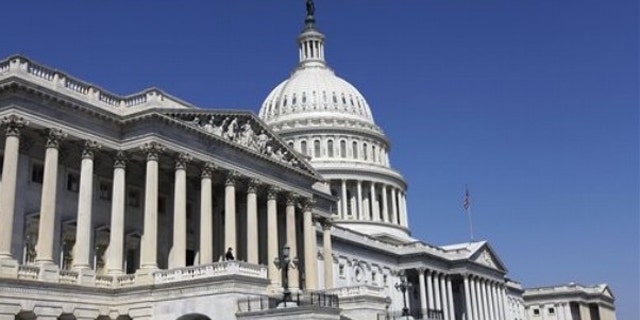 The US Capitol is seen in Washington, Wednesday, April 6, 2011, with the House of Representatives in the foreground, as Congress debates the budget. (AP Photo/Alex Brandon)