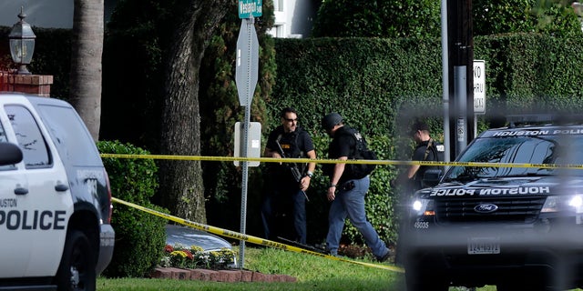 Police investigate the scene of a shooting in Houston on Sept. 26.