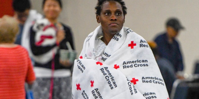 An evacuee rests at the George R. Brown Convention Center in Houston, Monday, Aug. 28, 2017.