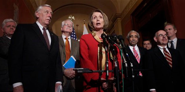 House Speaker Nancy Pelosi, center, speaks during a health care news conference on Capitol Hill Jan. 5. (AP Photo)