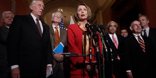 House Speaker Nancy Pelosi, center, speaks during a health care news conference on Capitol Hill Jan. 5. (AP Photo)
