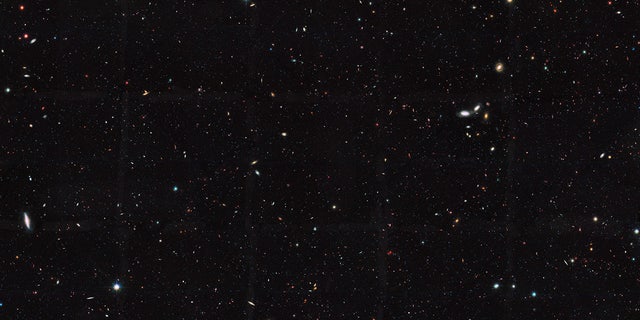 This Hubble Space Telescope view reveals thousands of galaxies stretching back into time across billions of light-years of space. The image covers a portion of a large galaxy census called the Great Observatories Origins Deep Survey (GOODS).