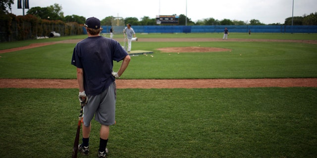 FORT WORTH - APRIL 29: Members of the Arlington Heights High School baseball team participate in a voluntary practice after state University Interscholastic League officials announced a delay until May 11 for all Texas high school sport and academic events as a precaution against the swine flu April 29, 2009 in Fort Worth, Texas. Members of the baseball team were given the option to workout on their own after the day's practice was cancelled. (Photo by Tom Pennington/Getty Images)