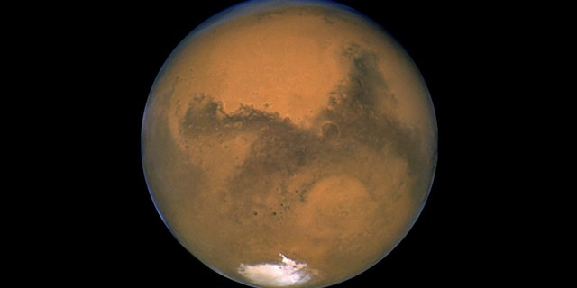 Hubble portrait of Mars taken Aug. 26, 2003 -- it's closest proximity in 59,619 years -- showing Hellas Basin.