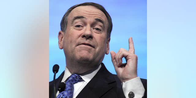 Former governor of Arkansas, Michael Huckabee addresses the National Rifle Association's 140th annual meeting, Saturday, April 30, 2011 in Pittsburgh. (AP Photo/Keith Srakocic)