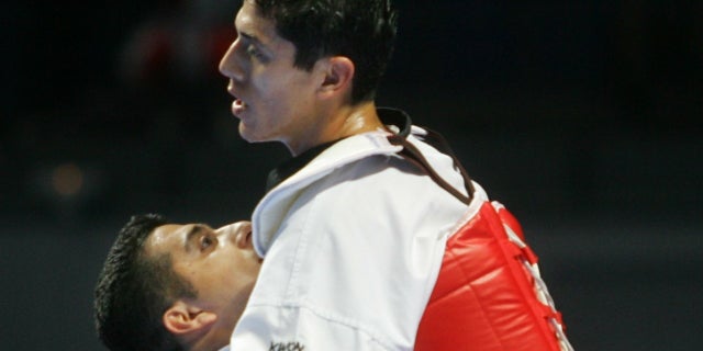 Jean Lopez, left, and Steven Lopez are now prominent coaches in the taekwondo industry.