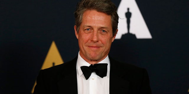 Hugh Grant says becoming a father at age 50 changed his disposition.