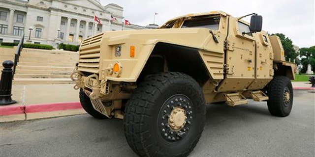 FILE - In this file photo taken May 26, 2015, a prototype of a Lockheed Martin Joint Light Tactical Vehicle is parked in front of the Arkansas state Capitol in Little Rock, Ark. (AP Photo/Danny Johnston, File)