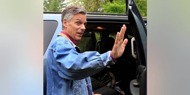 Former Republican Gov. Jon Huntsman, Jr., of Utah waves goodbye after greeting guests at a house party Monday, May 23, 2011 in Durham, N.H.. (AP Photo/Jim Cole)