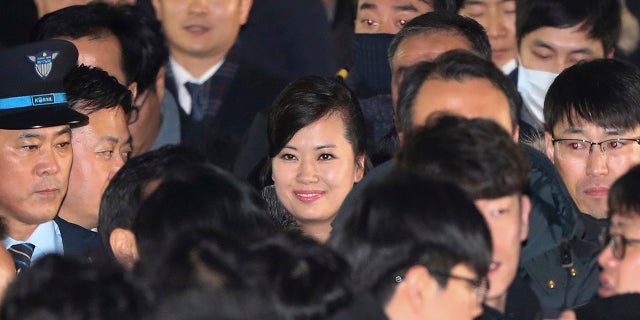 North Korean Hyon Song Wol, center, head of North Korea's art troupe, arrives and smiles at the Seoul Train Station in Seoul, South Korea, Jan. 21, 2018.