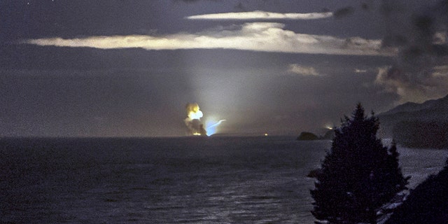 Aug. 25: A photo provided by Scott Wight shows the horizon from Cape Greville in Chiniak, Alaska, after a rocket carrying an experimental Army strike weapon exploded after taking off from a launch pad in Alaska.
