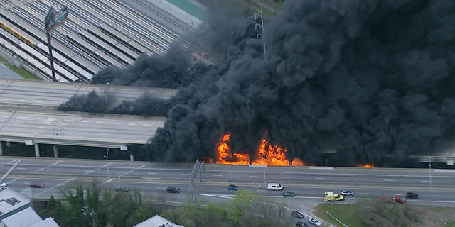 Part of Interstate 85 burns north of Atlanta, Ga. Thursday evening, March 30, 2017.