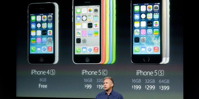 Phil Schiller, Apple's senior vice president of worldwide product marketing, speaks on stage during the introduction of the new iPhone 5c and 5s in Cupertino, Calif., Tuesday, Sept. 10, 2013. (AP Photo/Marcio Jose Sanchez)