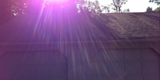 Experts agree with an Apple explanation: Purple lens flares such as this one are a common phenomenon in photography.