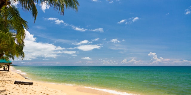 Sand beach with canoes in Phu Quoc close to Duong Dong, Vietnam