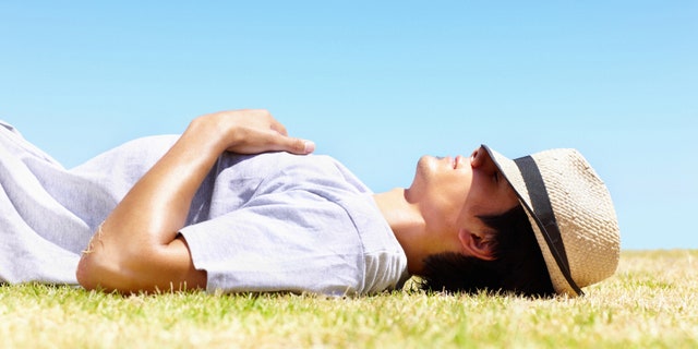 Young guy taking a rest in the hot sun - Outdoor