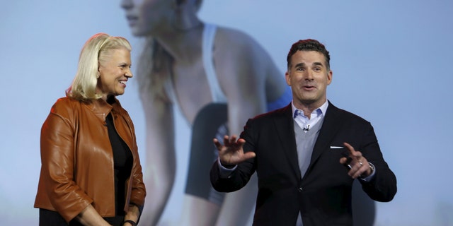 Ginni Rometty (L), chairman, president and CEO of IBM, listens to Kevin Plank, founder and CEO of Under Armour, during her keynote address at the 2016 CES trade show in Las Vegas, Nevada, Jan. 6, 2016. (REUTERS/Steve Marcus)