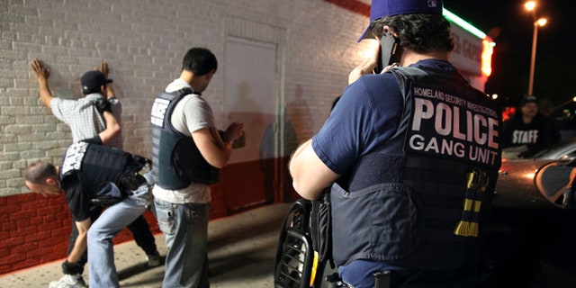 Immigration agents detain a man in Dallas, Texas.