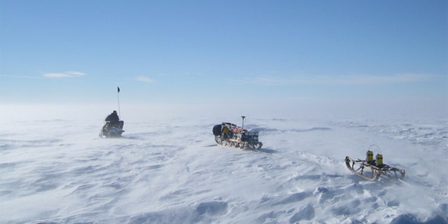 What wonders lie beneath? Radar equipment is driven across Antarctic ice during field work that revealed a massive rift.