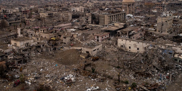 In this Nov. 9, 2017 photo, aerial view of the damaged hospital complex and surrounding areas in Mosul, Iraq. The complex, located in Mosul’s al-Shifaa neighborhood, was the main medical center for the Islamic State group during its rule and was heavily damaged during fighting when Iraqi forces wrested Mosul back from the militants.