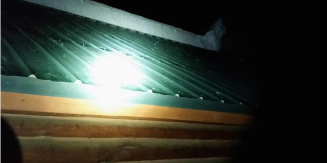 Several feet of snow fell from this cabin roof and buried three children. (EastIdahoNews.com)