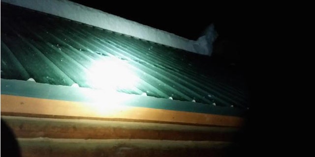 Several feet of snow fell from this cabin roof and buried three children. (EastIdahoNews.com)