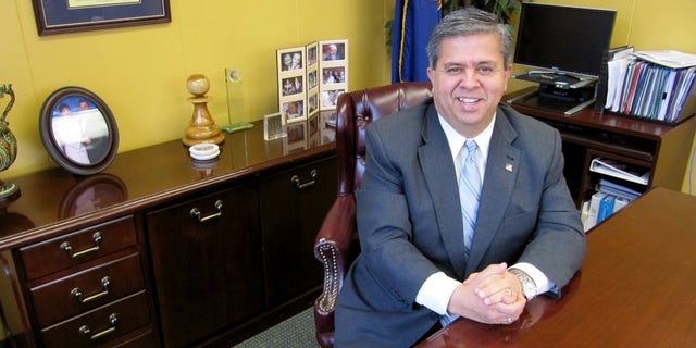 Feb. 9, 2010: FILE - In this file photo, Idaho Superintendent of Public Instruction Tom Luna poses for a photo at his office in Boise, Idaho. Parents across Idaho will now play a role in whether or not their childs teacher gets a raise.
