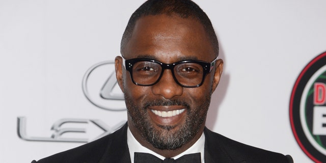 Idris Elba is denying theories that celebrities are paid to say they have coronavirus.