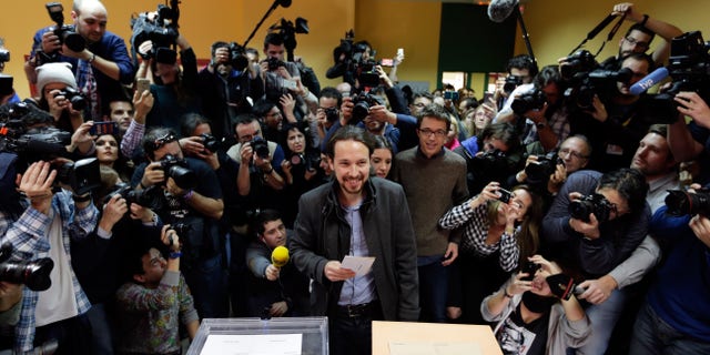 Pablo Iglesias, leader of Podemos party, casts his vote in Madrid, Sunday, Dec. 20, 2015.