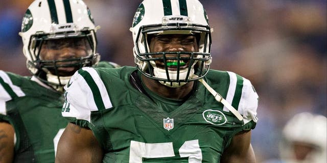 NASHVILLE, TN - DECEMBER 14: Ikemefuna Enemkpali #51 of the New York Jets celebrates in the fourth quarter after sacking the quarterback during a game against the Tennessee Titans at LP Field on December 14, 2014 in Nashville, Tennessee. The Jets defeated the Titans 16-11. (Photo by Wesley Hitt/Getty Images)