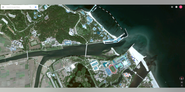 A wider shot of Kim’s estate shows a private bridge linking to another part of the island which has a railway, an air strip and a sports stadium.