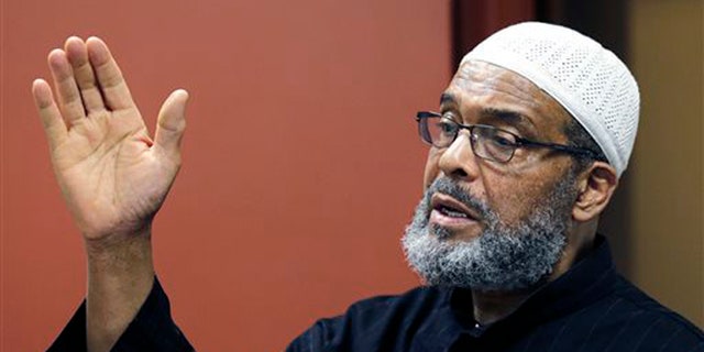 Imam Abdullah Faaruuq answers a question regarding the shooting of Usaama Rahim by law enforcement, during a news conference at the Black Community Information Center in the Roxbury neighborhood of Boston, Tuesday, June 9, 2015. The Muslim leader says video of the man being fatally shot by terror investigators shows authorities were "reckless and "dangerous" in their actions. Faaruuq is a leader of the Mosque for the Praising of Allah in Boston, where Usaama Rahimand his family prayed. (AP Photo/Charles Krupa)