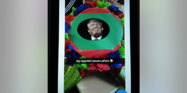 Photos of the piñata spread on social media.