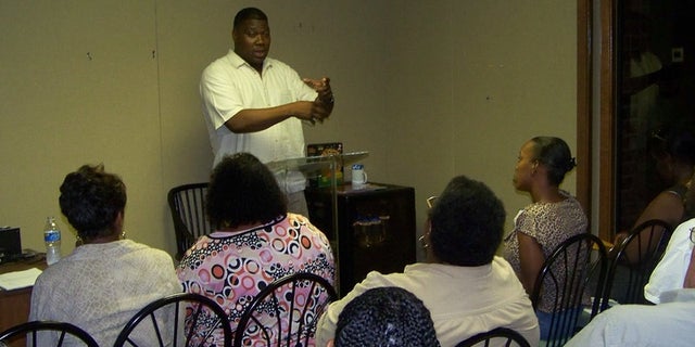'Trump for Urban Communities' leader Bruce Carter speaks to activists at a meeting.