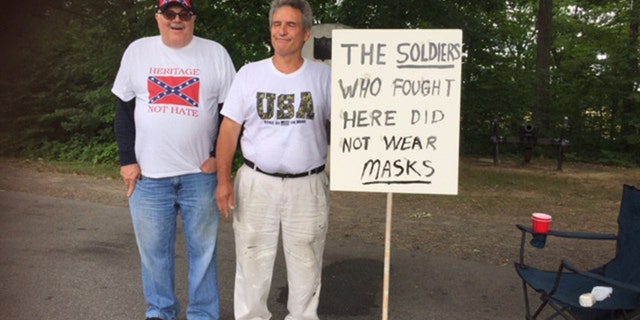 James Bibb (left) and Patrick Werner (right) on hand in Gettysburg, Pa. the men were there following rumors an alt-left group would be in attendance and try to burn the Confederate flag.