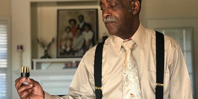 Captain Robert Johnson is showing an example of the bullets a hired hitman shot him with in 2010. Columbia, SC.