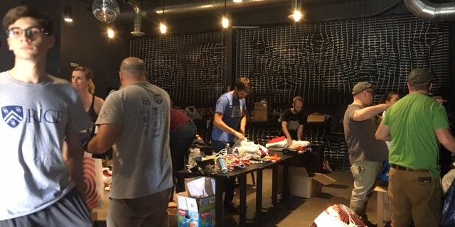 The Secret Group holds a donation drive at a local bar.