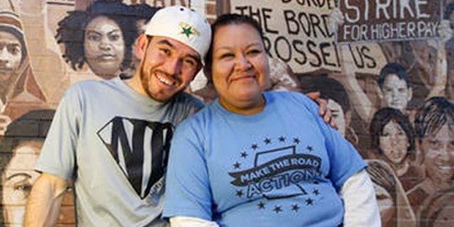 In this Wednesday, Oct. 26, 2016 photo, Guatemalan immigrant and construction worker Mauricio Pelaez-Alvarez, 33, left, poses for a photograph with immigrant rights activist Juana Alvarez, 39, (no relation) after each shared their thoughts with The Associated Press about the upcoming presidential election at Make the Road New York's Brooklyn offices in New York. Although Alvarez has lived in the United States since she emigrated at age 16, and Pelaez-Alvarez has been in the U.S. for ten years, neither can vote in the November election. (AP Photo/Kathy Willens)