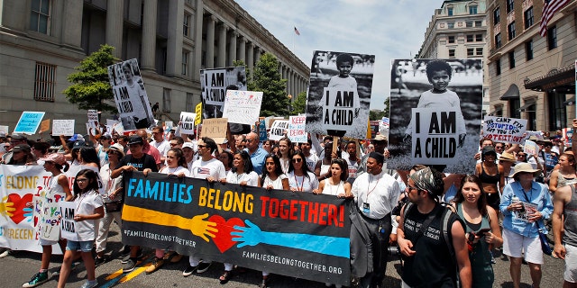 Activists march to protest the Trump administration's approach to illegal border crossings and separation of children from immigrant parents on Saturday in Washington.