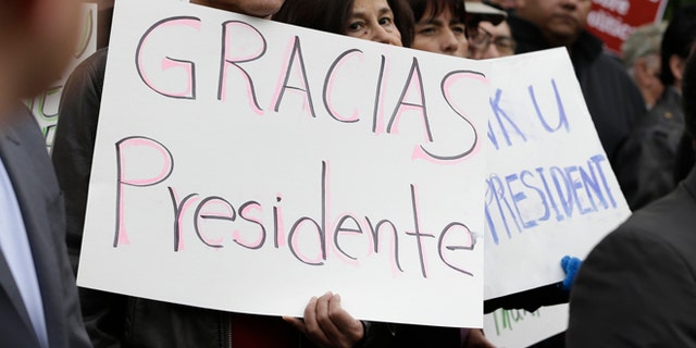 This Friday, Nov. 21, 2014 file photo shows activists and supporters celebrate President Barack Obama's executive action on immigration in Sacramento, Calif.