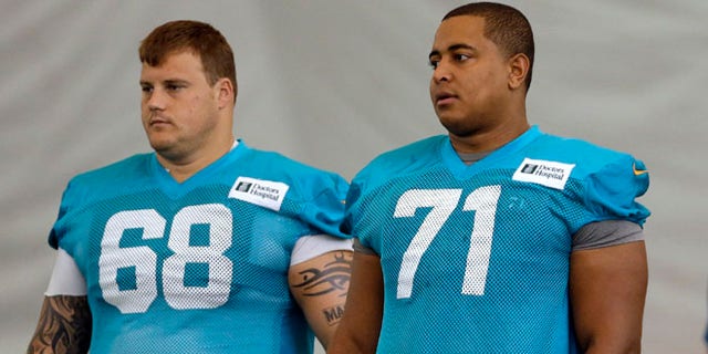 July 24, 2013: In this file photo, Miami Dolphins guard Richie Incognito (68) and tackle Jonathan Martin (71) stand on the field during NFL football practice in Davie, Fla.