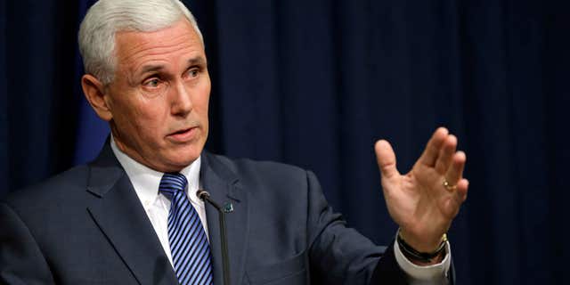 March 26, 2015: Indiana Gov. Mike Pence holds a news conference at the Statehouse in Indianapolis.