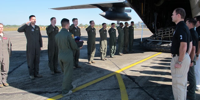 Members from Defense POW/MIA Accounting Agency (DPAA), conduct a dignified transfer ceremeony for possible human remains during a DPAA investigation mission at the Diburgarh Airport, Arunachal Pradesh, India, Dec. 13, 2016. (DoD photo by U.S. Marine Staff Sgt. Christopher Cantu)