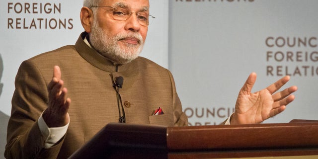 India's Prime Minister Narendra Modi speaks during a press conference at the Council on Foreign Relations, Monday, Sept. 29, 2014 in New York. (AP Photo/Bebeto Matthews)